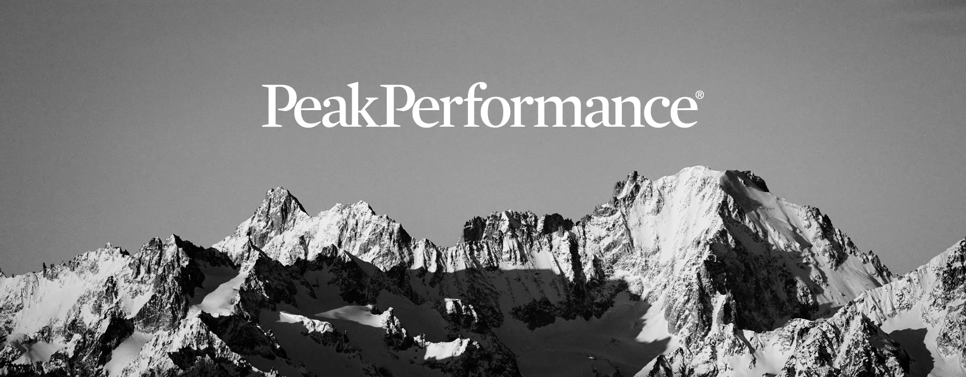 Peak Performance technical outdoor clothing in an alpine mountain setting